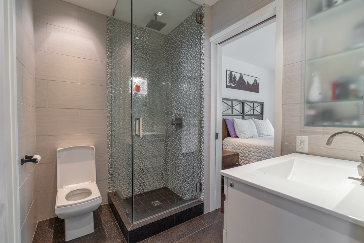 Bathroom with a glass shower and white vanity